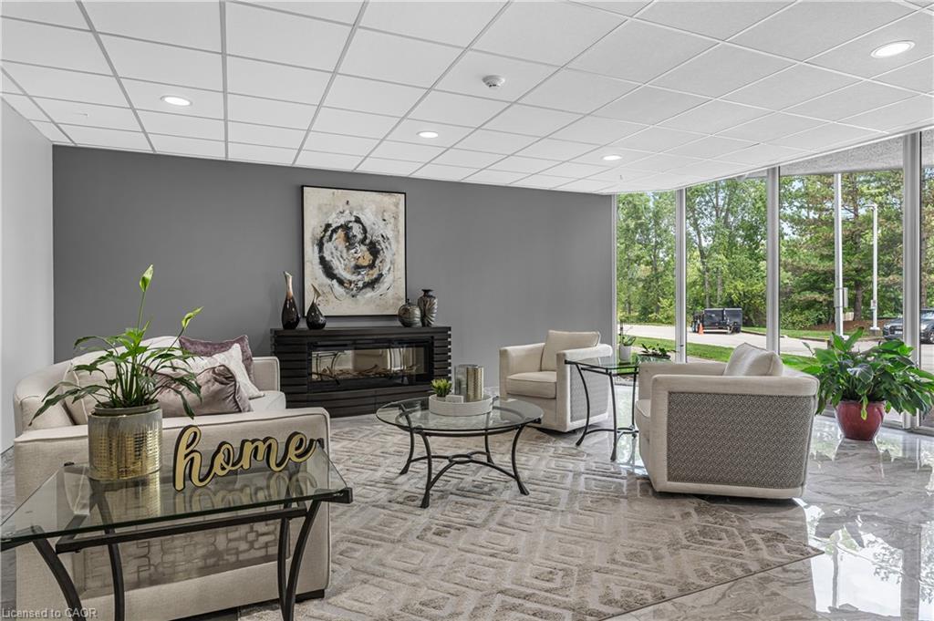 707-81 Scott Street, St. Catharines, ON - Indoor Photo Showing Living Room With Fireplace