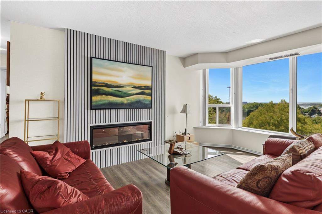 707-81 Scott Street, St. Catharines, ON - Indoor Photo Showing Living Room With Fireplace