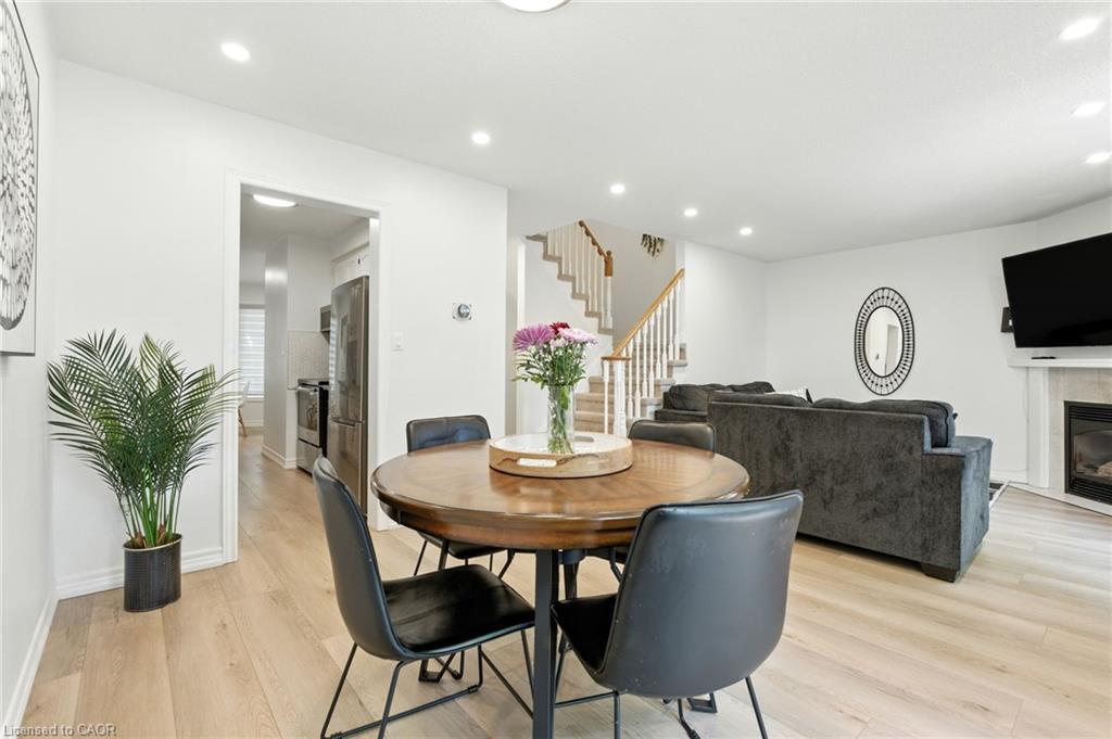 4-2252 Walkers Line, Burlington, ON - Indoor Photo Showing Dining Room With Fireplace