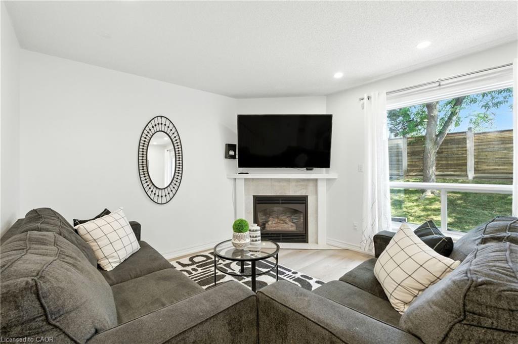 4-2252 Walkers Line, Burlington, ON - Indoor Photo Showing Living Room With Fireplace