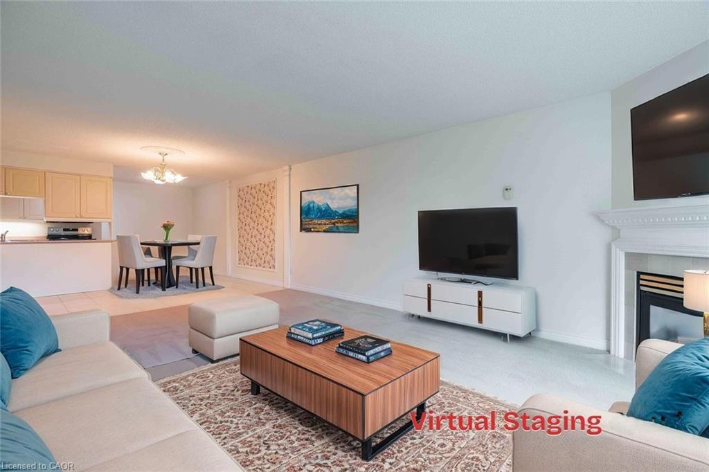 207-980 Golf Links Road, Hamilton, ON - Indoor Photo Showing Living Room With Fireplace