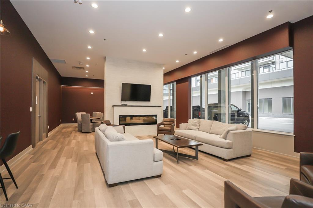 304-560 North Service Road, Grimsby, ON - Indoor Photo Showing Living Room With Fireplace