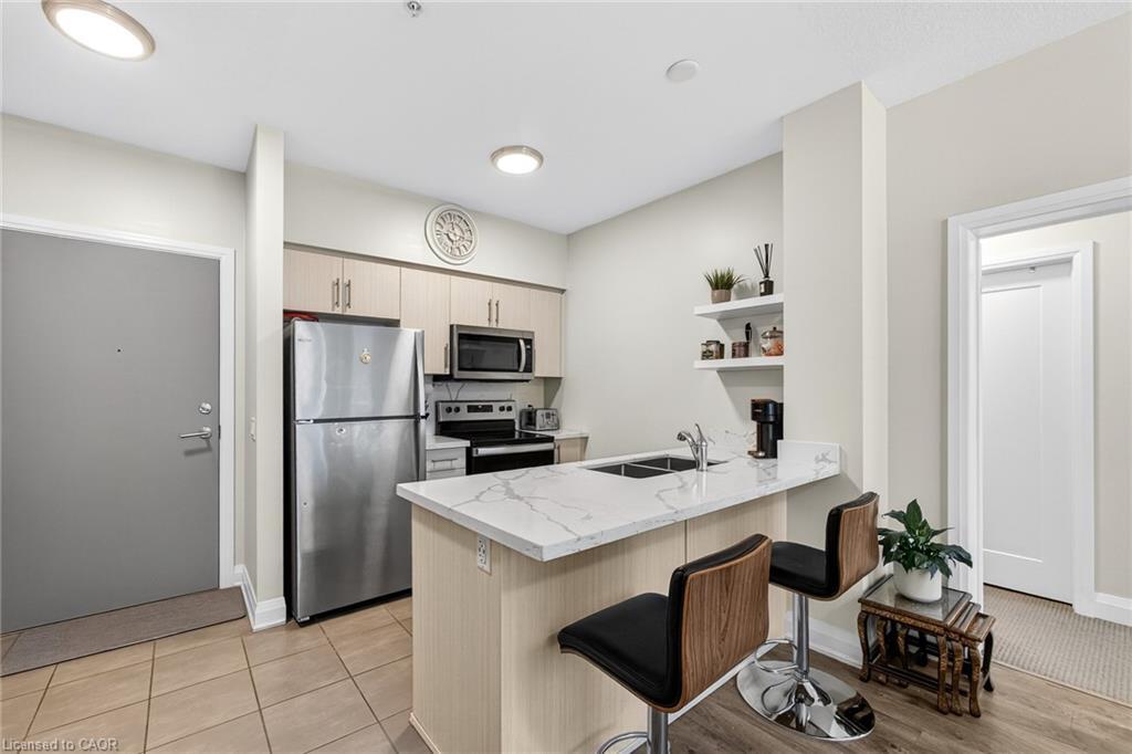 402-16 Concord Place, Grimsby, ON - Indoor Photo Showing Kitchen With Double Sink
