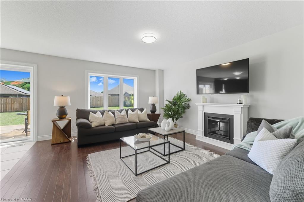 97 Forbes Crescent, Listowel, ON - Indoor Photo Showing Living Room With Fireplace