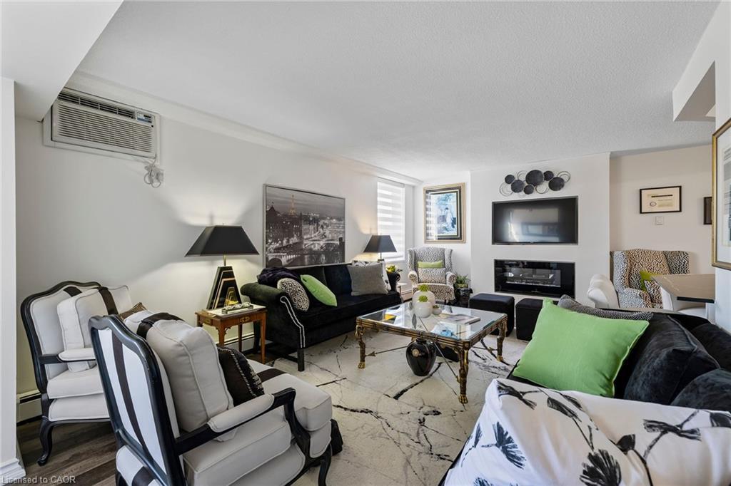 602-141 Church Street, St. Catharines, ON - Indoor Photo Showing Living Room With Fireplace