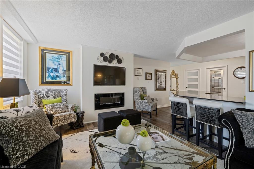602-141 Church Street, St. Catharines, ON - Indoor Photo Showing Living Room With Fireplace