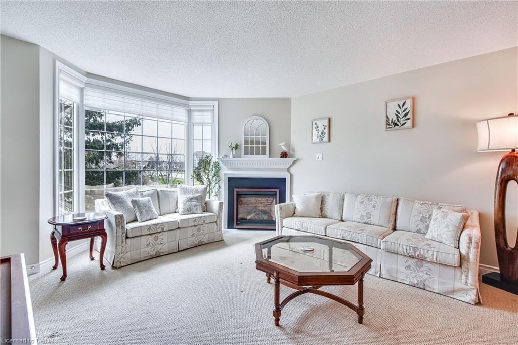 205-970 Golf Links Road, Ancaster, ON - Indoor Photo Showing Living Room With Fireplace