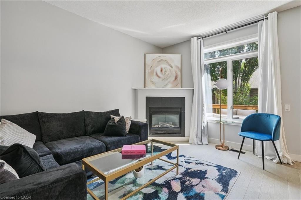 3-5200 Dorchester Road, Niagara Falls, ON - Indoor Photo Showing Living Room With Fireplace