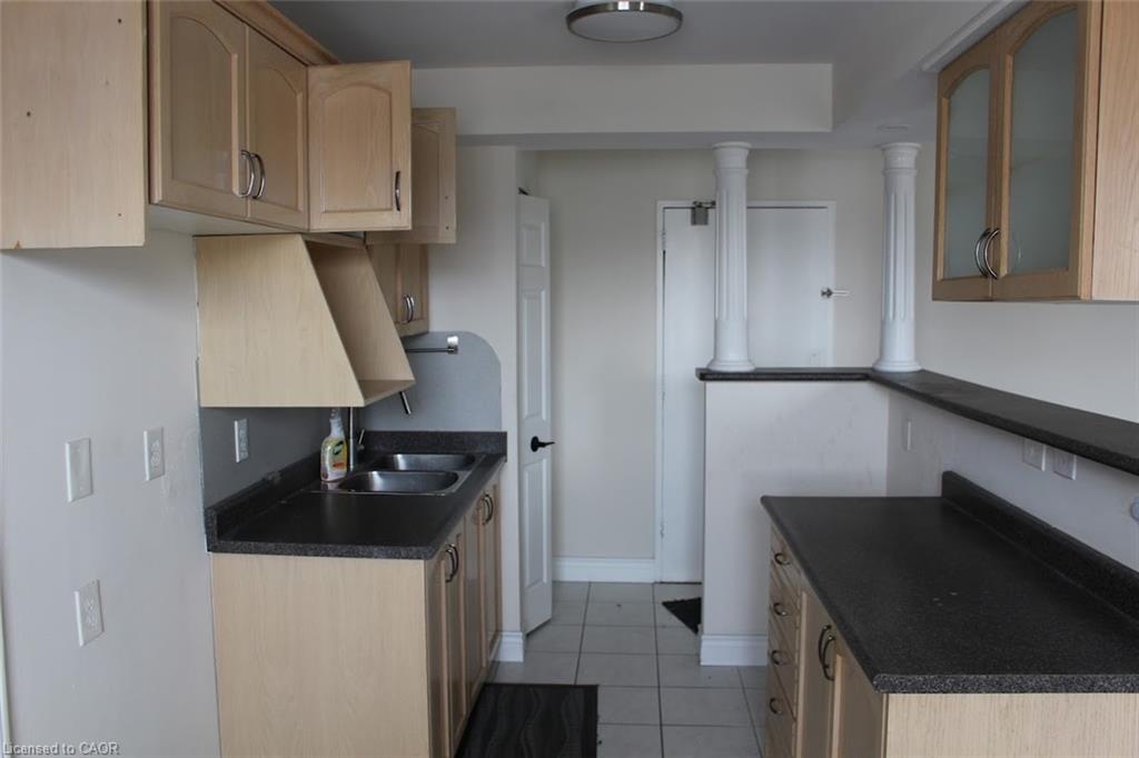 204-851 Queenston Road, Hamilton, ON - Indoor Photo Showing Kitchen With Double Sink