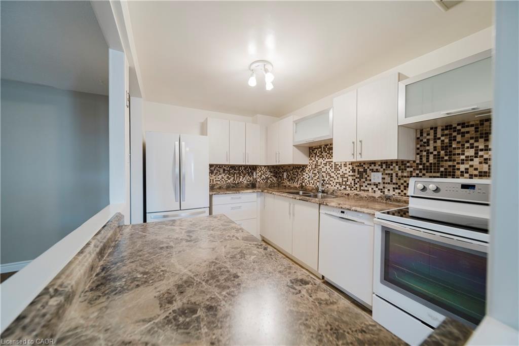 110-279 Chandler Drive, Kitchener, ON - Indoor Photo Showing Kitchen With Double Sink