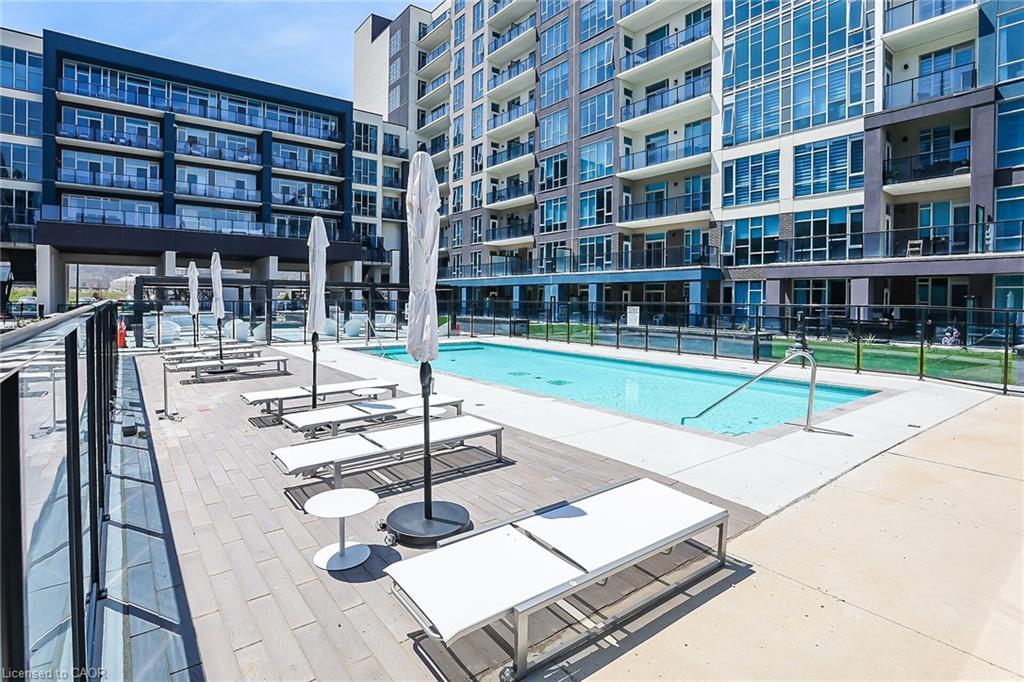 431-16 Concord Place, Grimsby, ON - Outdoor With In Ground Pool With Facade