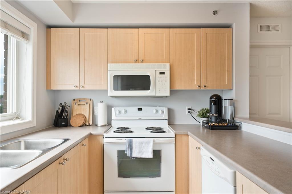 304-4450 Fairview Street, Burlington, ON - Indoor Photo Showing Kitchen With Double Sink