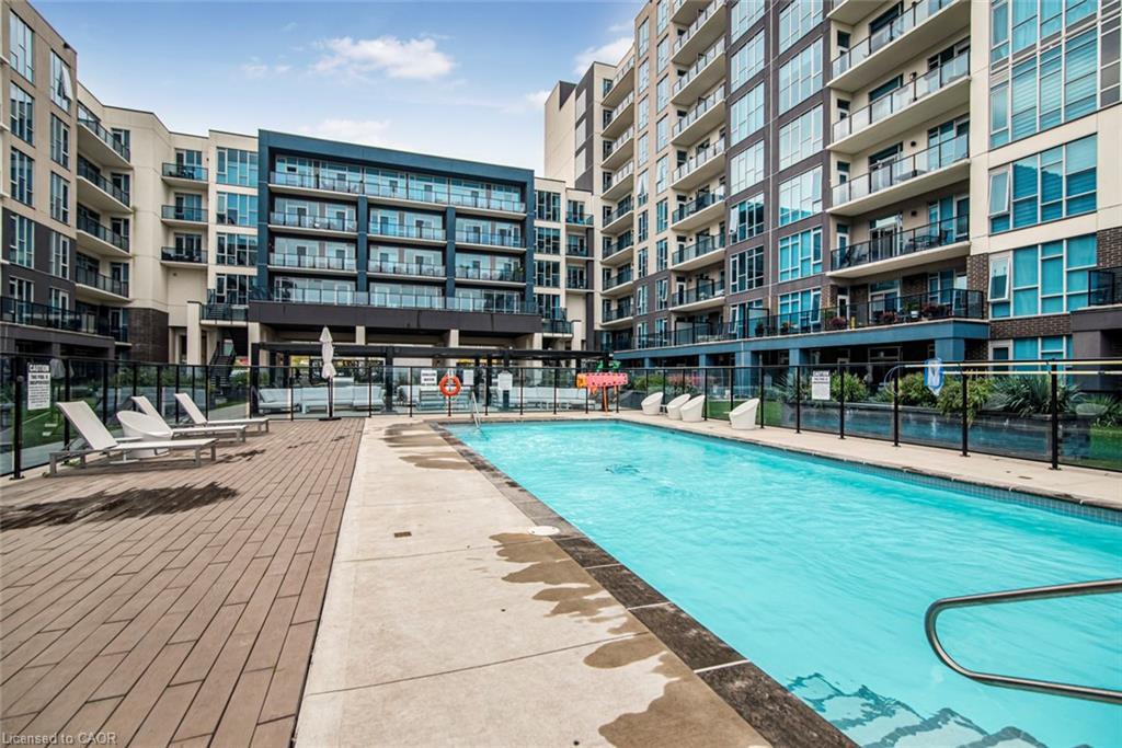 120-16 Concord Place, Grimsby, ON - Outdoor With In Ground Pool With Facade