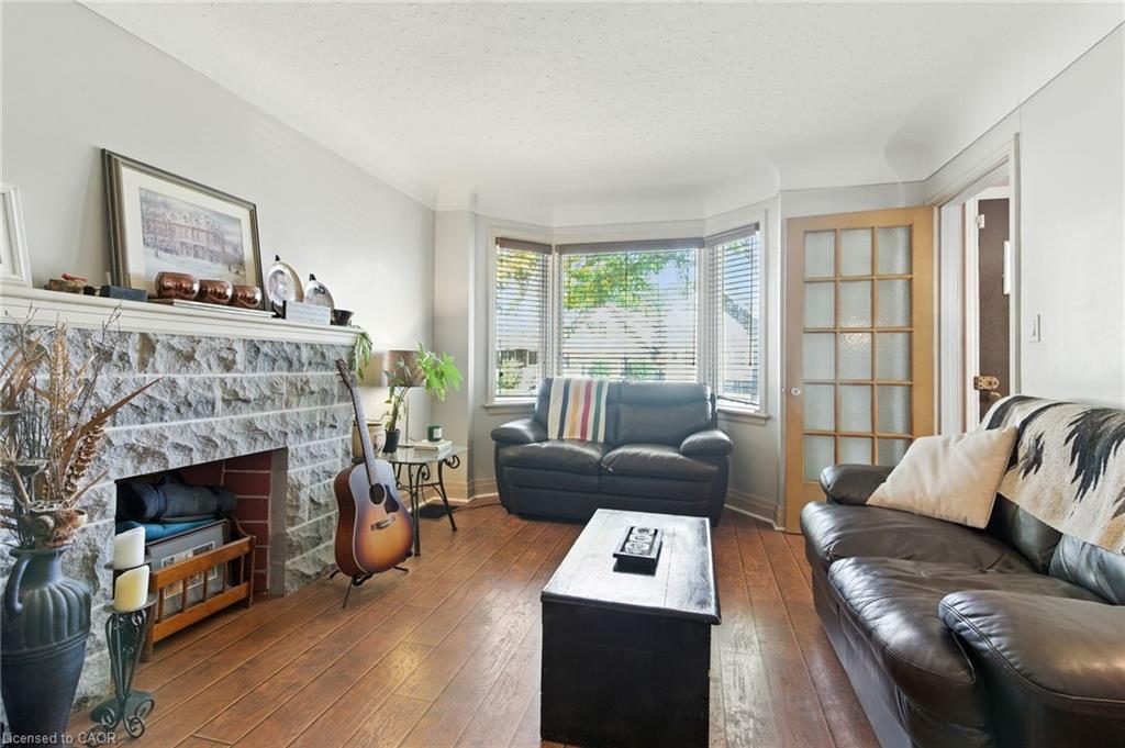 608 Fennell Avenue E, Hamilton, ON - Indoor Photo Showing Living Room With Fireplace