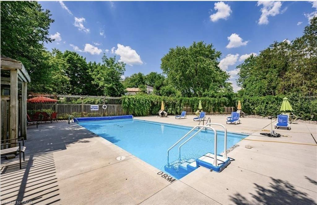 405-89 Westwood Road, Guelph, ON - Outdoor With In Ground Pool With Backyard