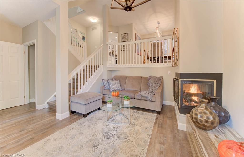 61-225 Benjamin Road, Waterloo, ON - Indoor Photo Showing Living Room With Fireplace