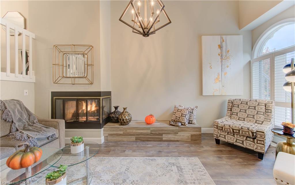 61-225 Benjamin Road, Waterloo, ON - Indoor Photo Showing Living Room With Fireplace