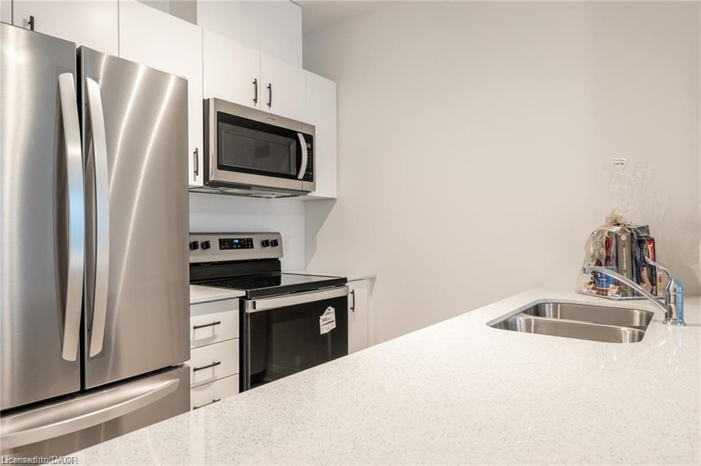 512-1936 Rymal Road E, Hamilton, ON - Indoor Photo Showing Kitchen With Stainless Steel Kitchen With Double Sink