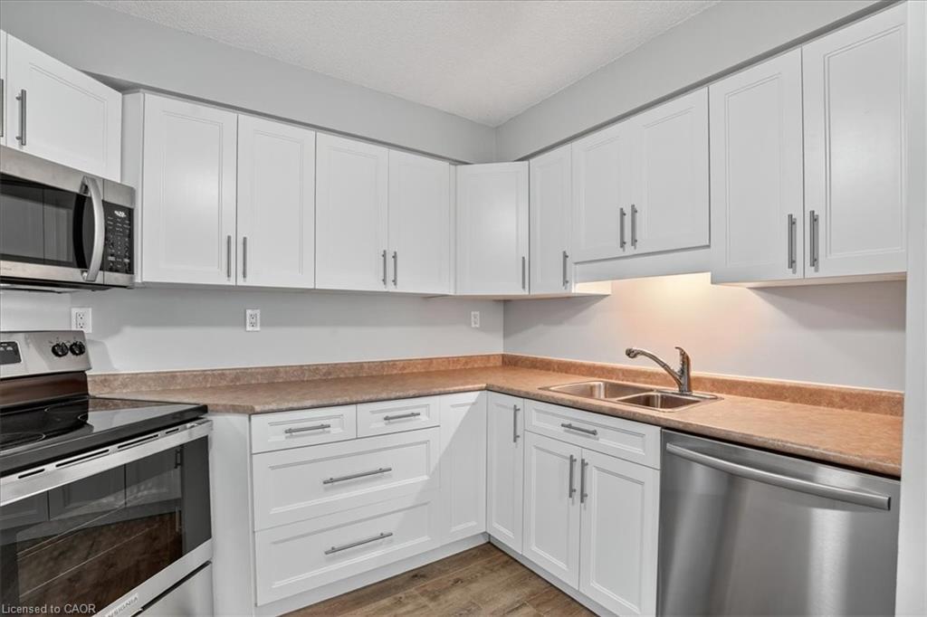 506-3227 King Street E, Kitchener, ON - Indoor Photo Showing Kitchen With Double Sink