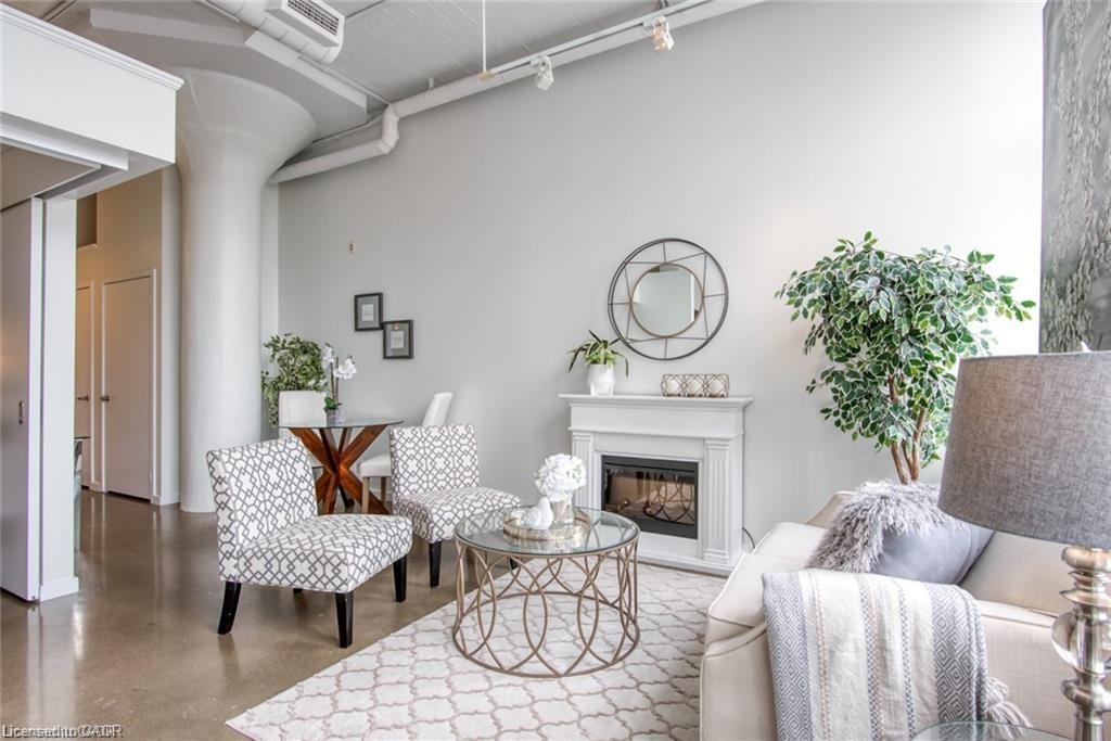 212-404 King Street W, Kitchener, ON - Indoor Photo Showing Other Room With Fireplace