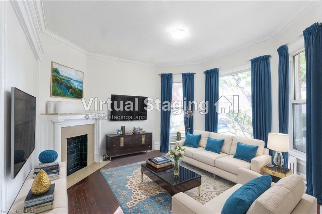 87 Gage Avenue S, Hamilton, ON - Indoor Photo Showing Living Room With Fireplace