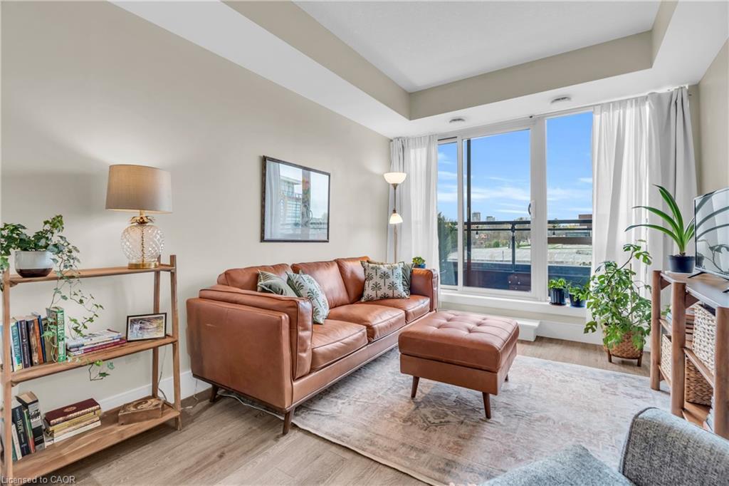 412-155 St. Leger Street, Kitchener, ON - Indoor Photo Showing Living Room With Fireplace