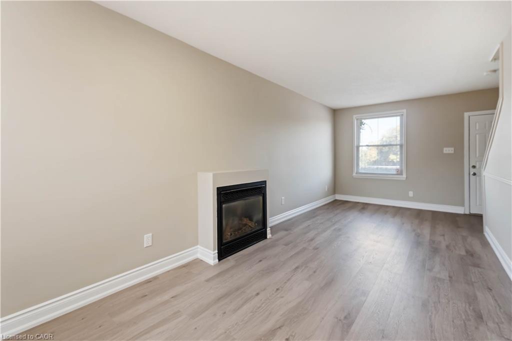 187 Barton Street W, Hamilton, ON - Indoor Photo Showing Living Room With Fireplace