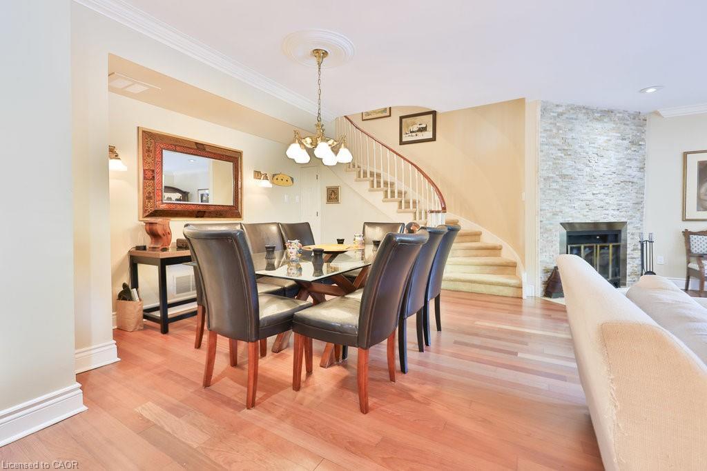 68 Tradewind Drive, Oakville, ON - Indoor Photo Showing Dining Room With Fireplace