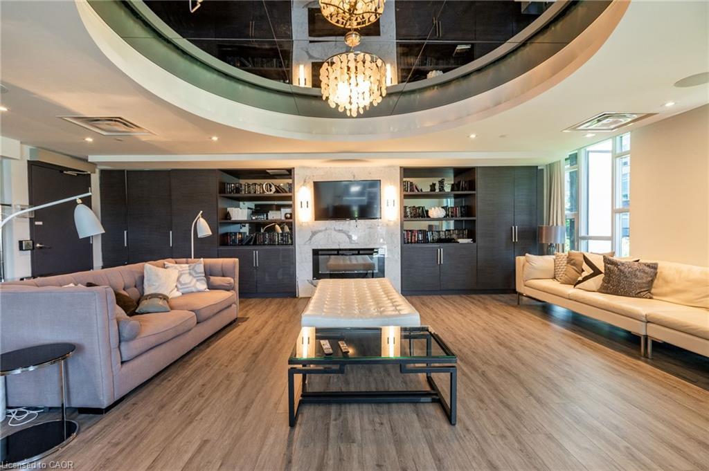 512-10 Concord Place, Grimsby, ON - Indoor Photo Showing Living Room With Fireplace