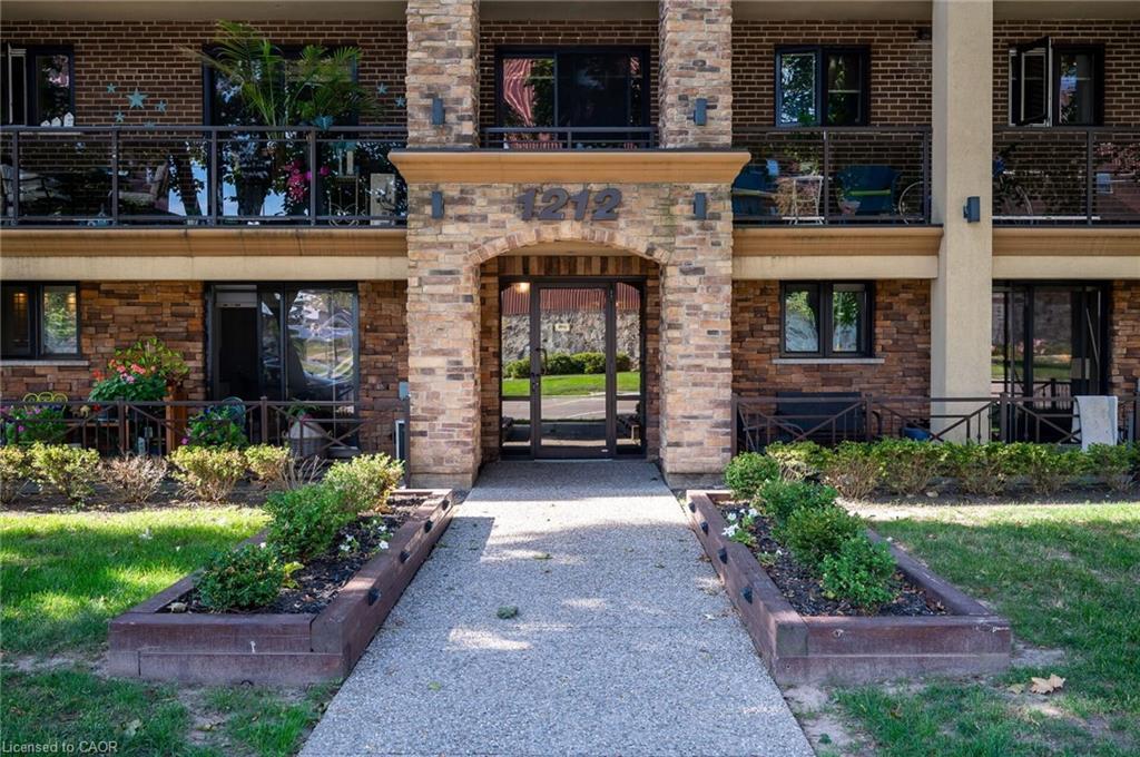 303-1212 Fennell Avenue E, Hamilton, ON - Outdoor With Fireplace