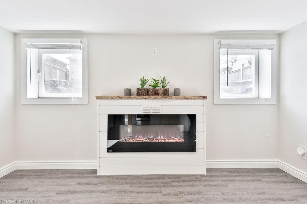 Lower-47 Castlefield Drive, Hamilton, ON - Indoor Photo Showing Living Room With Fireplace