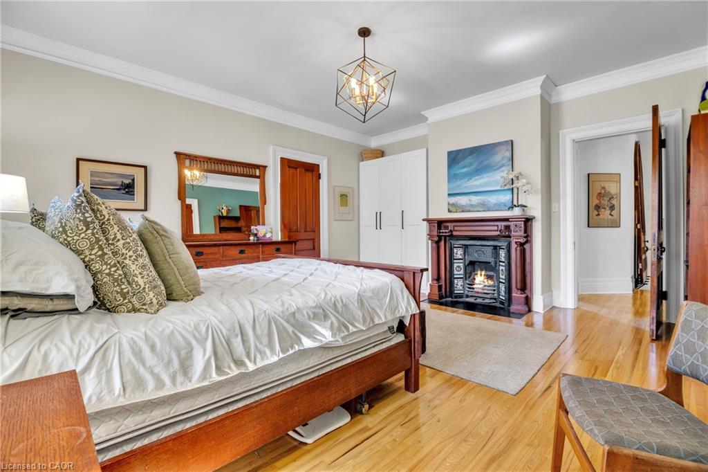 105 Vansittart Avenue, Woodstock, ON - Indoor Photo Showing Bedroom With Fireplace