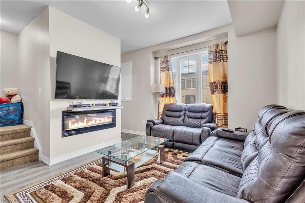 68 Esplanade Lane, Grimsby, ON - Indoor Photo Showing Living Room With Fireplace
