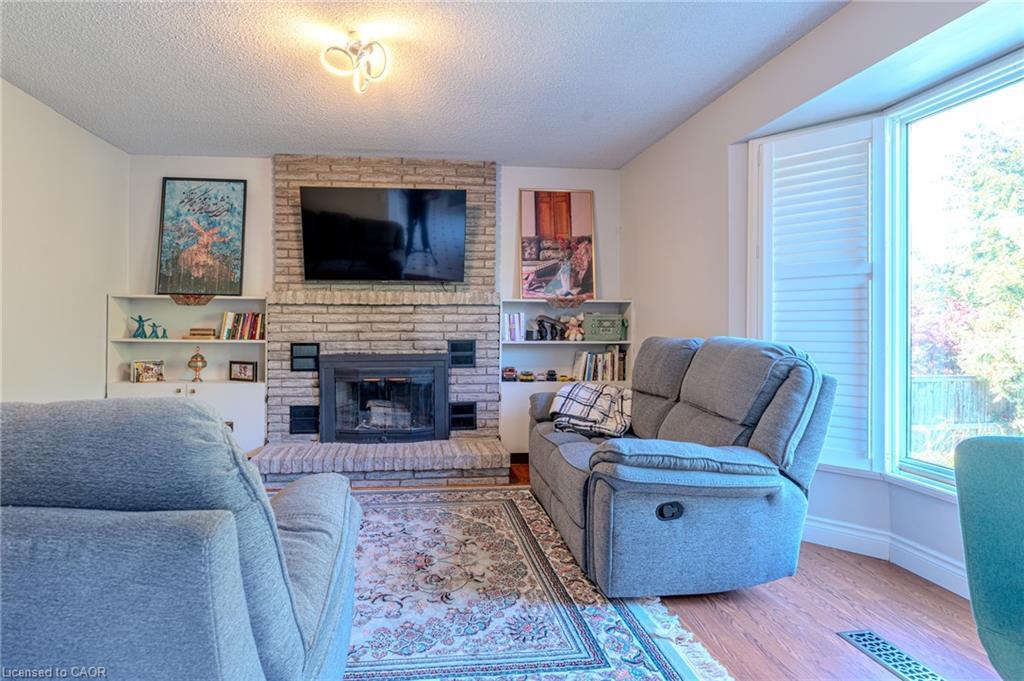 Upper-14 Windstar Place, Hamilton, ON - Indoor Photo Showing Living Room With Fireplace