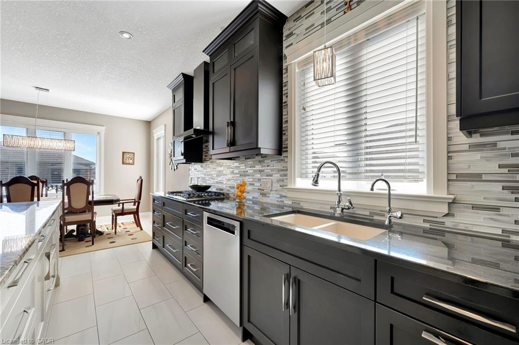 107 Forbes Crescent, Listowel, ON - Indoor Photo Showing Kitchen With Double Sink With Upgraded Kitchen
