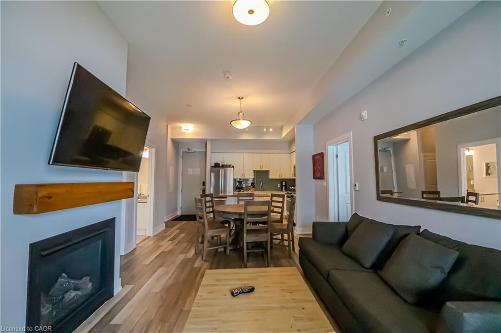 031-25 Pen Lake Point Road, Huntsville, ON - Indoor Photo Showing Living Room With Fireplace