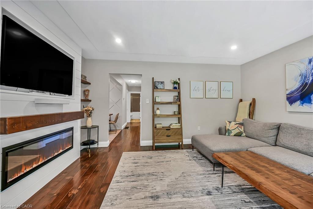 A-174 Kings Forest Drive, Hamilton, ON - Indoor Photo Showing Living Room With Fireplace