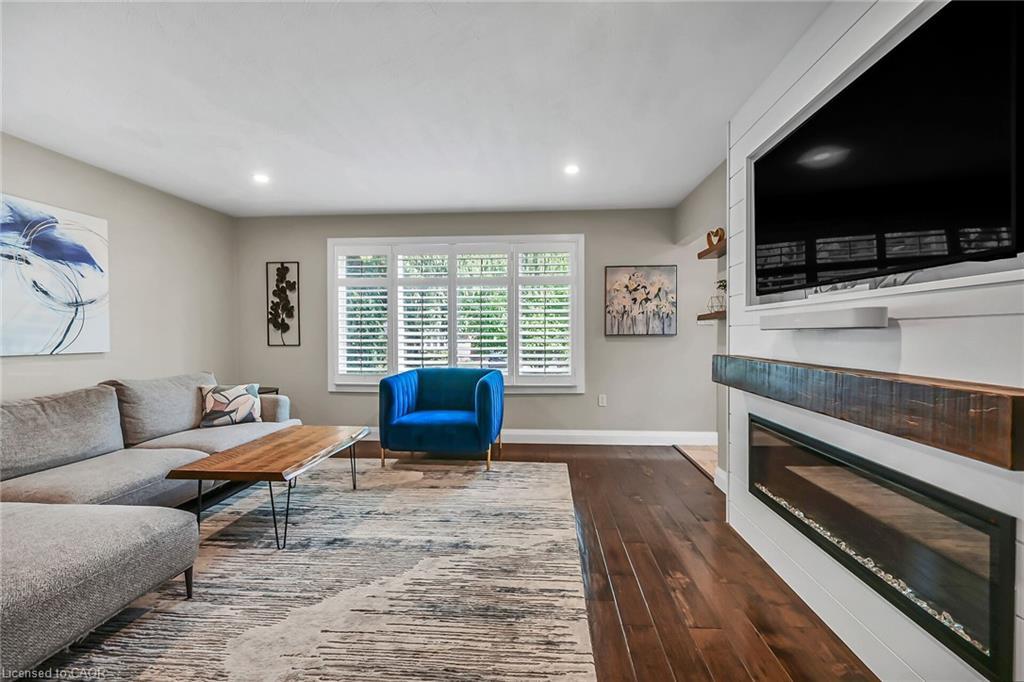 A-174 Kings Forest Drive, Hamilton, ON - Indoor Photo Showing Living Room With Fireplace