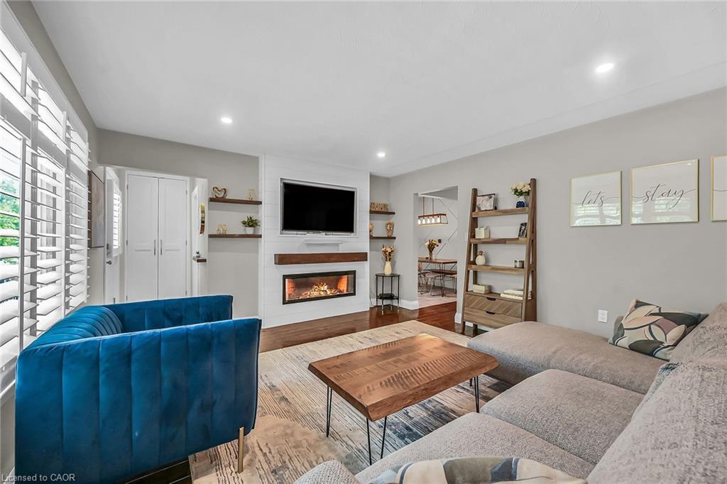 A-174 Kings Forest Drive, Hamilton, ON - Indoor Photo Showing Living Room With Fireplace