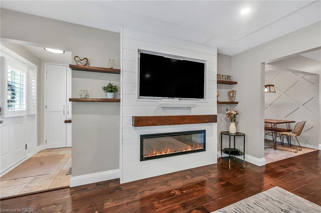 A-174 Kings Forest Drive, Hamilton, ON - Indoor Photo Showing Living Room With Fireplace