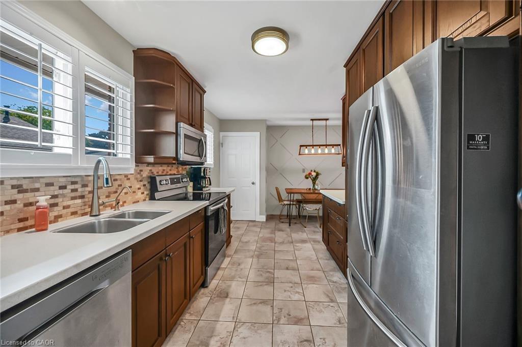 A-174 Kings Forest Drive, Hamilton, ON - Indoor Photo Showing Kitchen With Double Sink