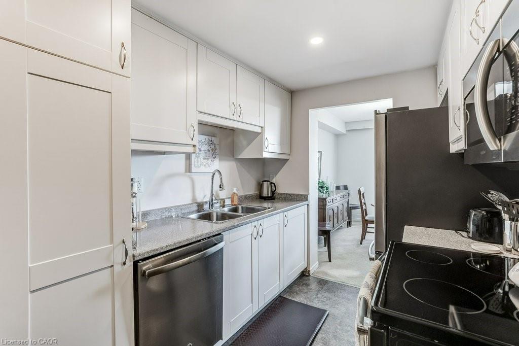 205-2055 Upper Middle Road, Burlington, ON - Indoor Photo Showing Kitchen With Double Sink