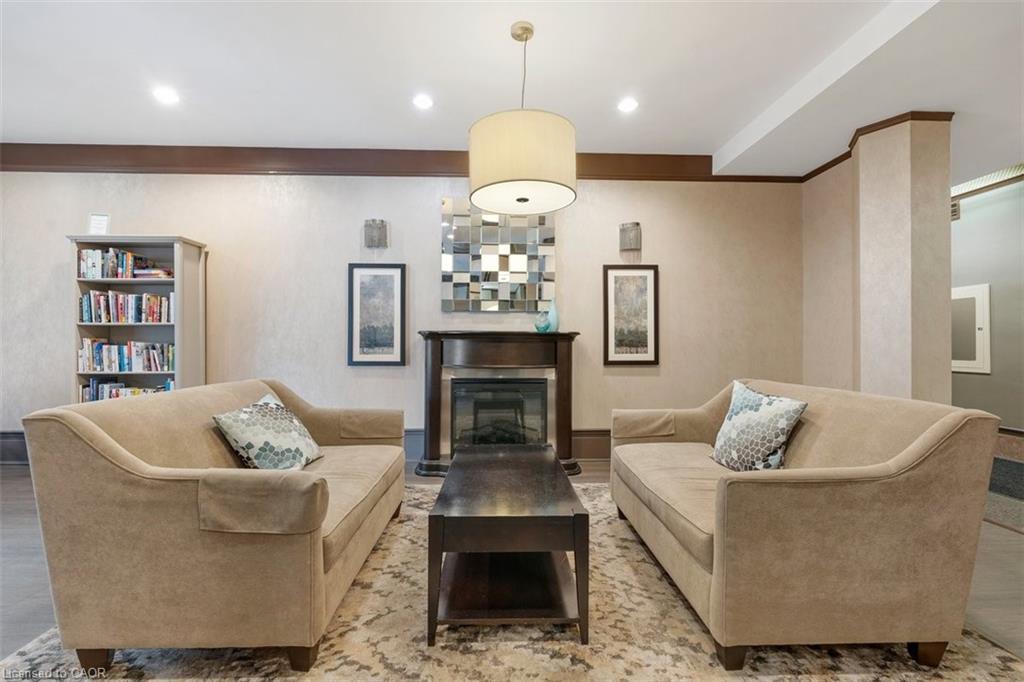 102-67 Caroline Street S, Hamilton, ON - Indoor Photo Showing Living Room With Fireplace