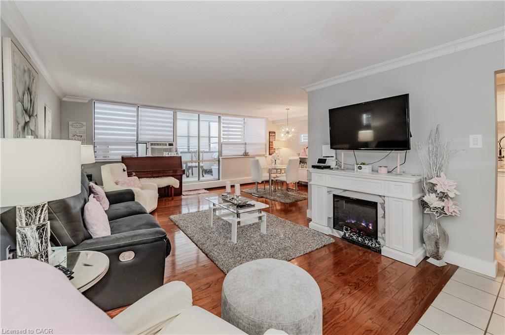 801-65 Westmount Road N, Waterloo, ON - Indoor Photo Showing Living Room With Fireplace