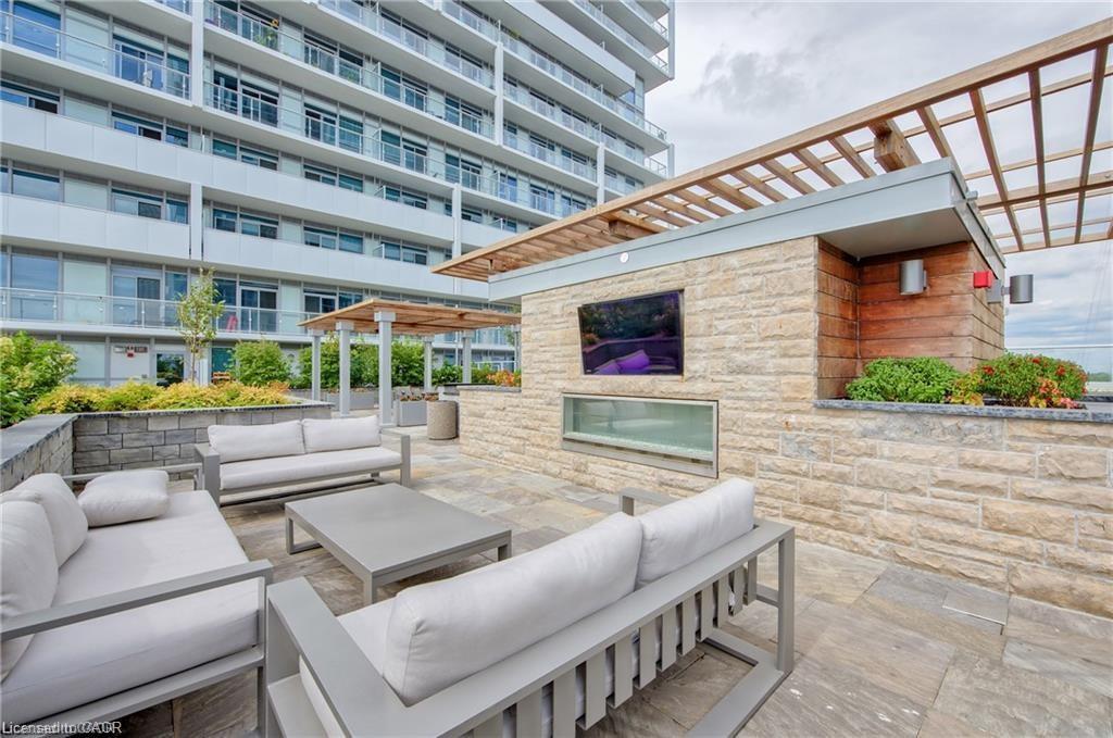 1603-55 Speers Road, Oakville, ON - Outdoor With Fireplace