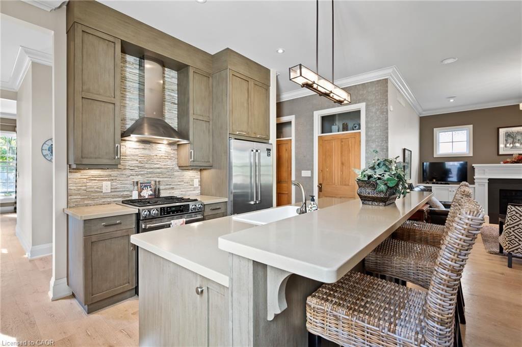 52 Garrison Village Drive, Niagara-On-The-Lake, ON - Indoor Photo Showing Kitchen With Fireplace With Upgraded Kitchen