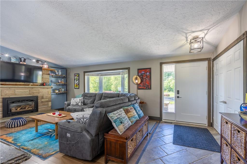1750 Turkey Point Road, Simcoe, ON - Indoor Photo Showing Living Room With Fireplace
