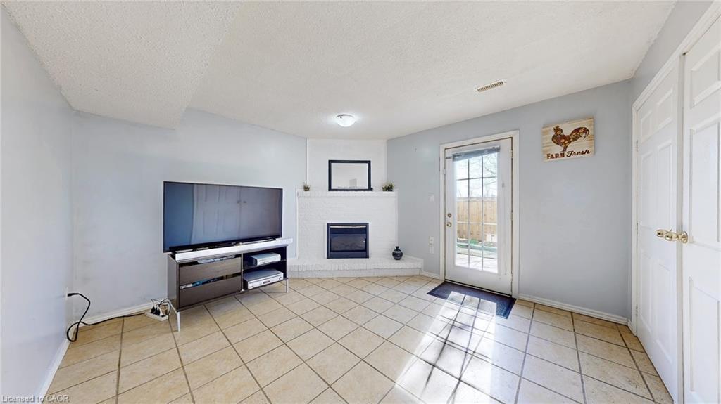 43-1155 Paramount Drive, Stoney Creek, ON - Indoor With Fireplace