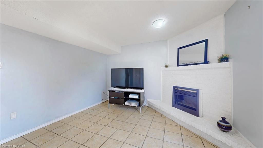 43-1155 Paramount Drive, Stoney Creek, ON - Indoor With Fireplace