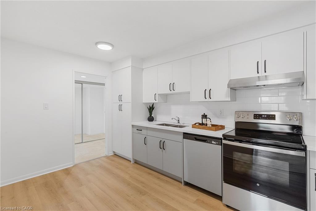 604-2185 Marine Drive, Oakville, ON - Indoor Photo Showing Kitchen With Double Sink